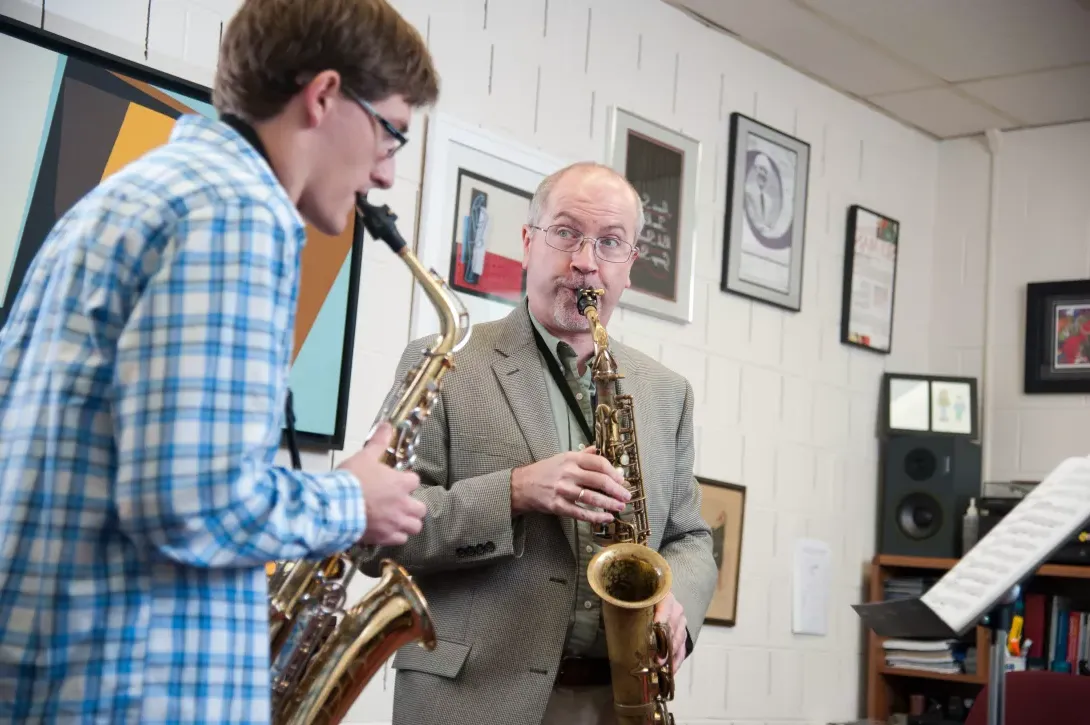 Tom Reed giving a saxaphone lesson